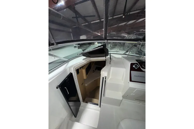 Slide: The Image of Interior view of 2010 Sea Ray Sundancer 280 cabin entrance with steps and Garmin equipment. - 12