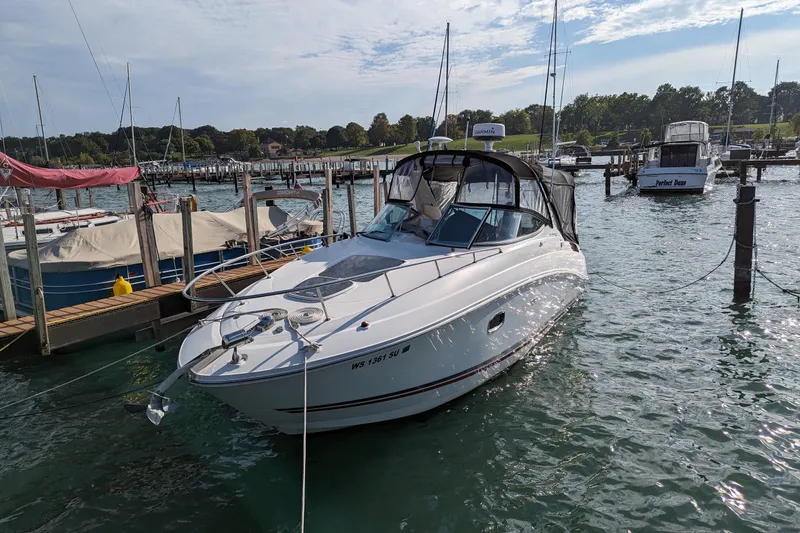 Slide: The Image of 2010 Sea Ray Sundancer 280 docked at a marina on a sunny day. - 2