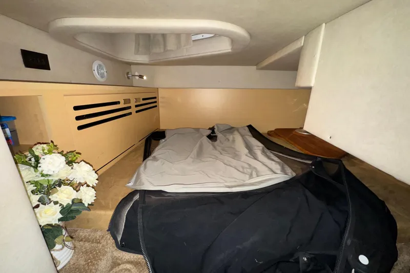 Slide: The Image of Interior cabin of 2010 Sea Ray Sundancer 280 with bedding and floral decor. - 21