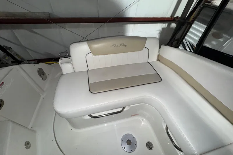 Slide: The Image of 2010 Sea Ray Sundancer 280 boat interior with white and beige seating. - 6