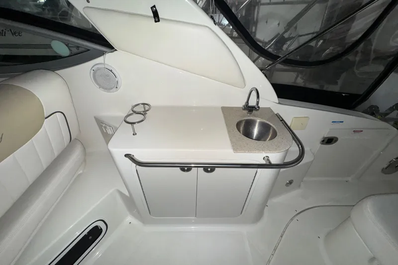 Slide: The Image of Interior of 2010 Sea Ray Sundancer 280 with sink and seating area. - 7