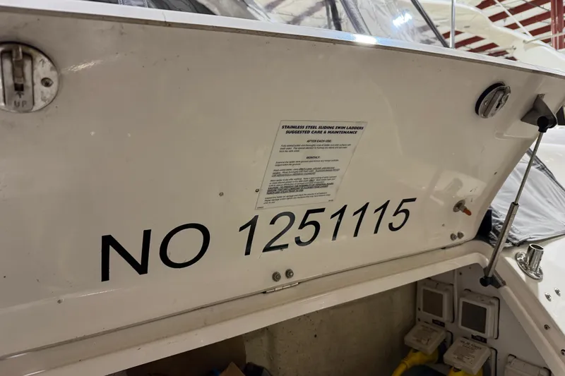 Slide: The Image of 2005 Sea Ray 360 Sundancer boat with registration number NO 1251115 displayed. - 21