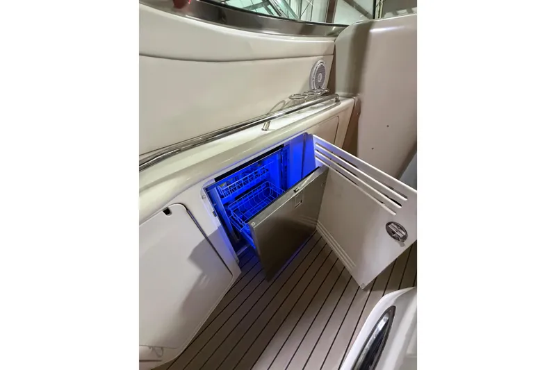Slide: The Image of Open refrigerator on 2005 Sea Ray 360 Sundancer boat with blue interior lighting. - 31