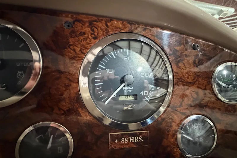 Slide: The Image of Dashboard of a 2005 Sea Ray 360 Sundancer showing RPM gauge and hours. - 39