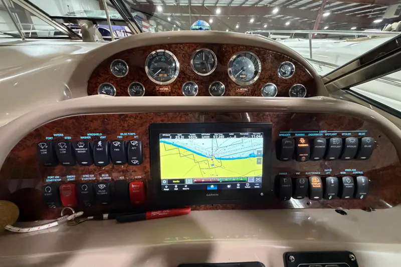 Slide: The Image of Control panel of a 2005 Sea Ray 360 Sundancer with navigation display and gauges. - 41