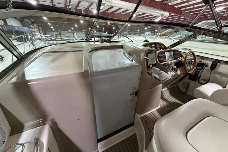 Slide: The Image of Interior view of 2005 Sea Ray 360 Sundancer yacht cockpit with steering wheel and controls. - 43