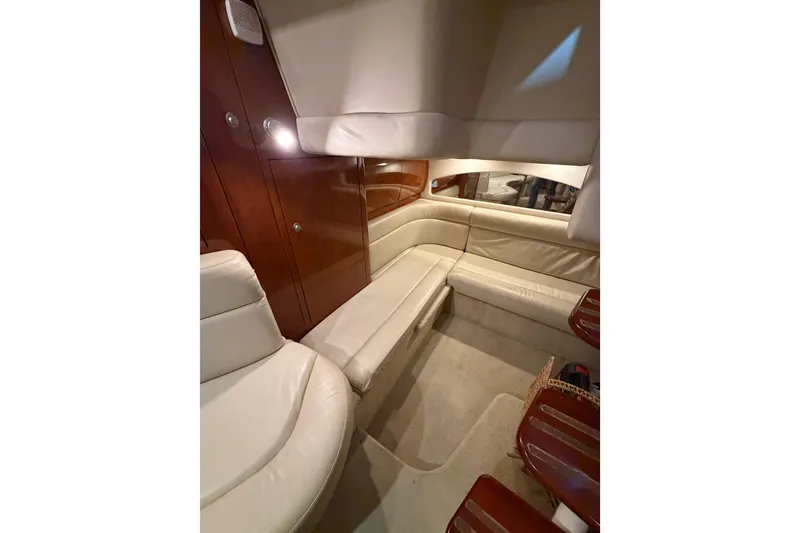 Slide: The Image of Interior of 2005 Sea Ray 360 Sundancer with cream leather seating and wooden accents. - 45