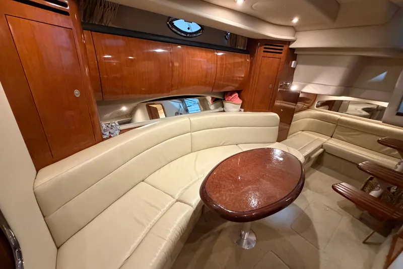 Slide: The Image of Luxurious interior of 2005 Sea Ray 360 Sundancer yacht with elegant seating and wooden finishes. - 49