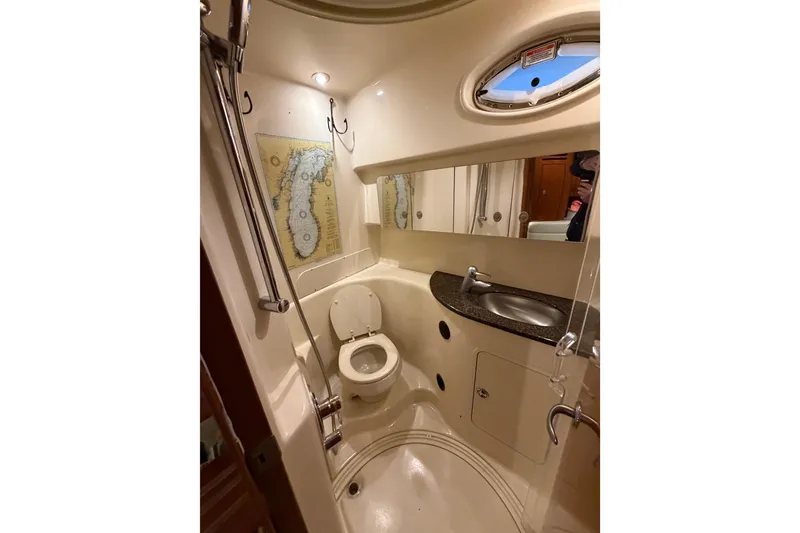Slide: The Image of 2005 Sea Ray 360 Sundancer bathroom with shower, toilet, and sink. - 50