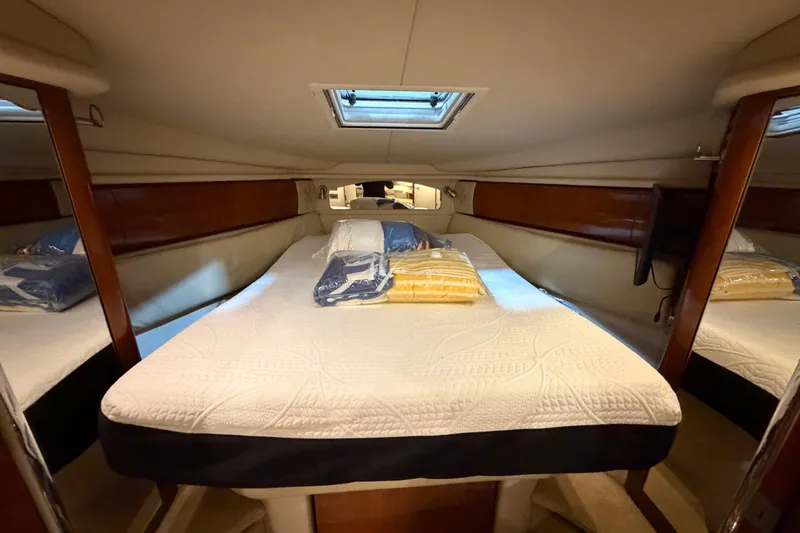 Slide: The Image of Luxurious cabin interior of 2005 Sea Ray 360 Sundancer yacht with cozy bedding. - 51