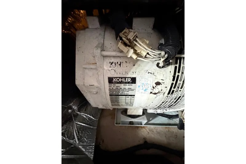 Slide: The Image of Engine compartment of a 2005 Sea Ray 360 Sundancer with Kohler generator. - 59
