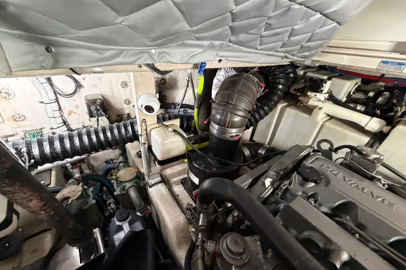 Slide: The Image of Engine compartment of a 2005 Sea Ray 360 Sundancer boat, showcasing mechanical components. - 62