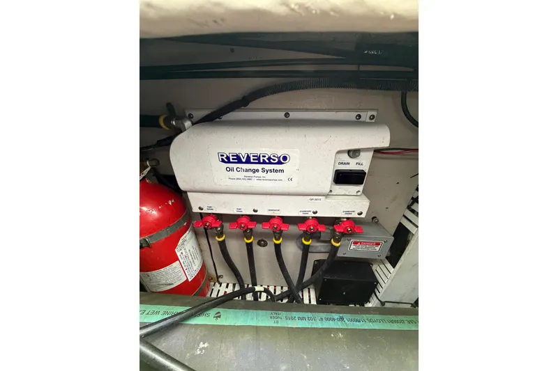 Slide: The Image of Engine compartment of 2005 Sea Ray 360 Sundancer with Reverso oil change system. - 63