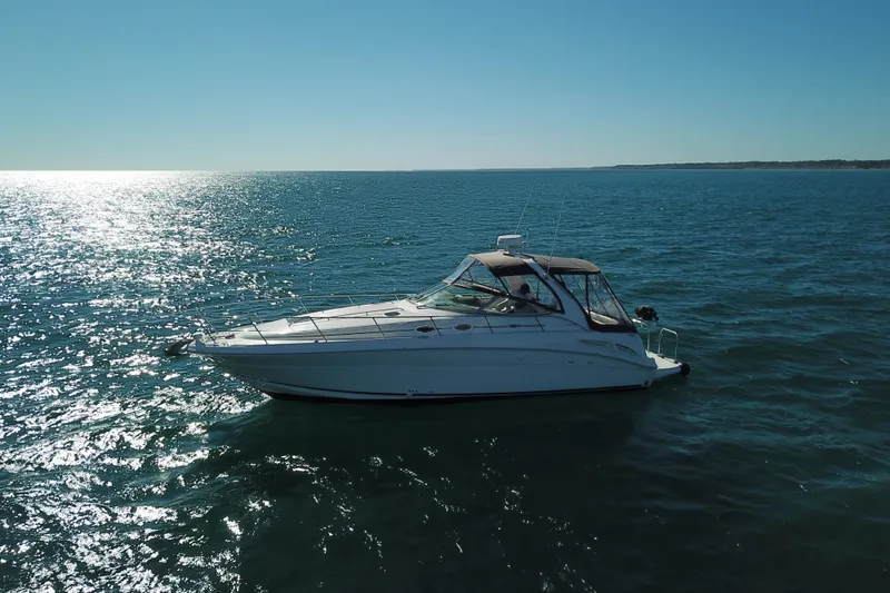 Slide: The Image of 2005 Sea Ray 360 Sundancer yacht cruising on a sunny ocean. - 7