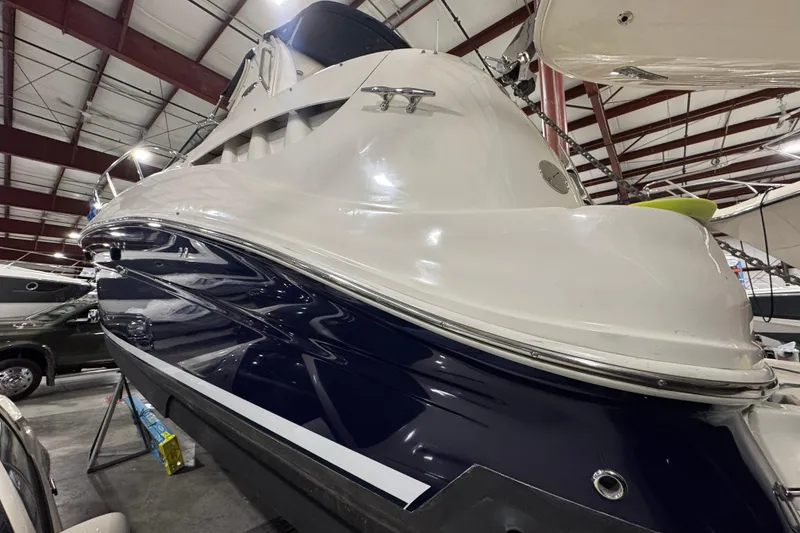 Slide: The Image of 2004 Sea Ray Sundancer 320 yacht in indoor storage facility. - 25