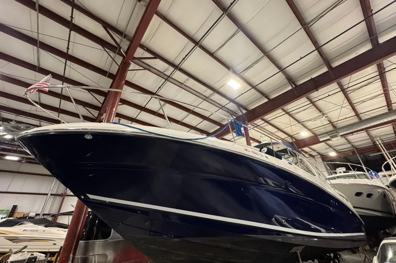 Slide: The Image of 2004 Sea Ray Sundancer 320 boat in indoor storage facility. - 27