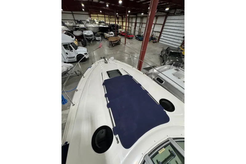 Slide: The Image of 2004 Sea Ray Sundancer 320 in storage facility, view from bow deck. - 34