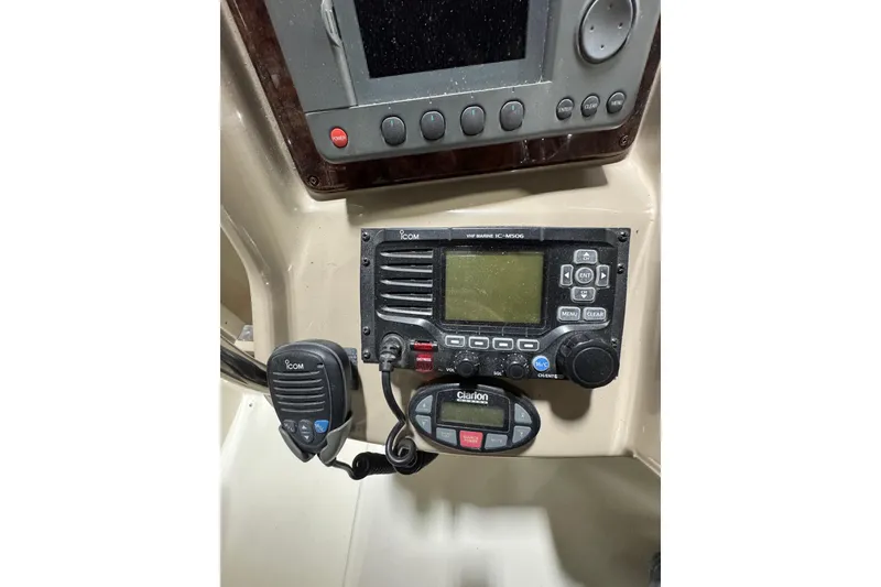 Slide: The Image of Control panel of a 2004 Sea Ray Sundancer 320 with Icom marine radio. - 44