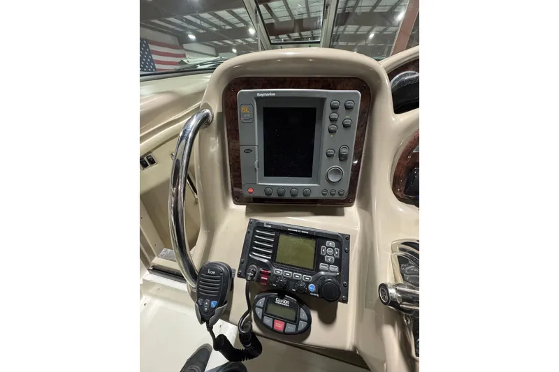 Slide: The Image of Control panel of a 2004 Sea Ray Sundancer 320 with navigation and communication equipment. - 45