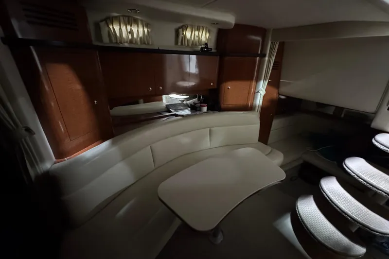 Slide: The Image of Interior of 2004 Sea Ray Sundancer 320 yacht with elegant seating and wooden cabinetry. - 51