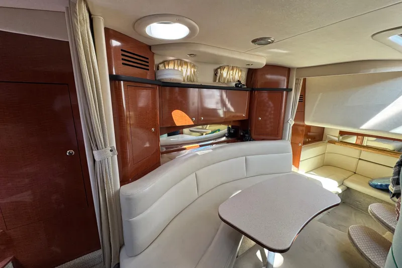 Slide: The Image of Luxurious interior of 2004 Sea Ray Sundancer 320 yacht with elegant seating and cabinetry. - 62