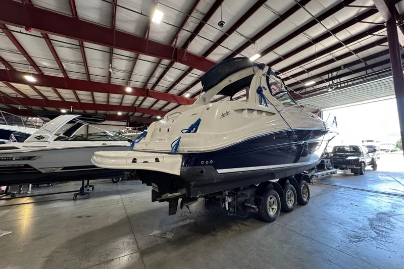 Slide: The Image of 2004 Sea Ray Sundancer 320 yacht on trailer in indoor storage facility. - 66