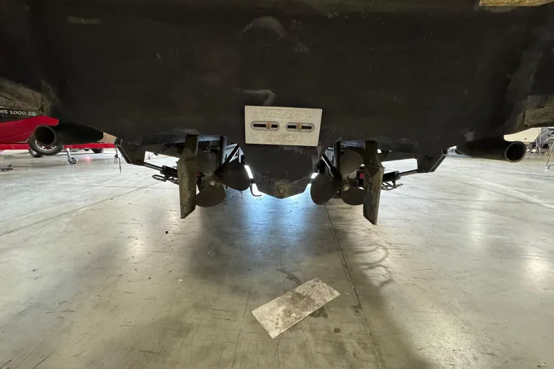 Slide: The Image of Underneath view of a 2004 Sea Ray Sundancer 320 boat in a garage. - 69