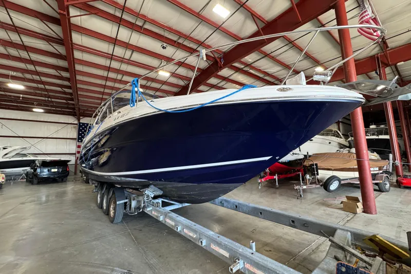 Slide: The Image of 2004 Sea Ray Sundancer 320 boat on trailer in indoor storage facility. - 72