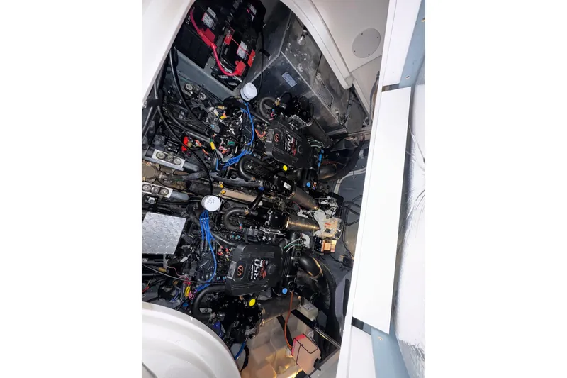Slide: The Image of Engine compartment of a 2004 Sea Ray Sundancer 320 boat, showcasing dual engines. - 77
