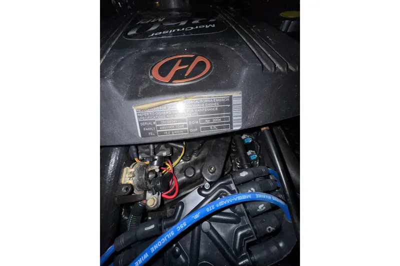 Slide: The Image of Engine of a 2004 Sea Ray Sundancer 320 boat with visible wiring and labels. - 78