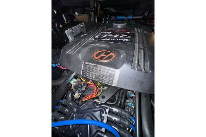 Slide: The Image of Engine of a 2004 Sea Ray Sundancer 320 boat, featuring Mercury components. - 79