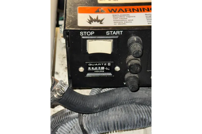 Slide: The Image of Control panel of a 2004 Sea Ray Sundancer 320 boat with warning label. - 80
