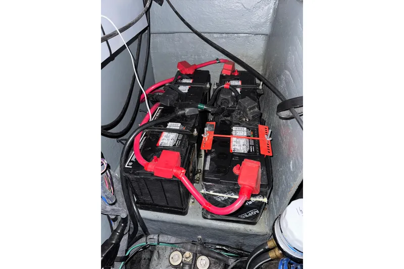Slide: The Image of Batteries in a 2004 Sea Ray Sundancer 320 boat engine compartment. - 82