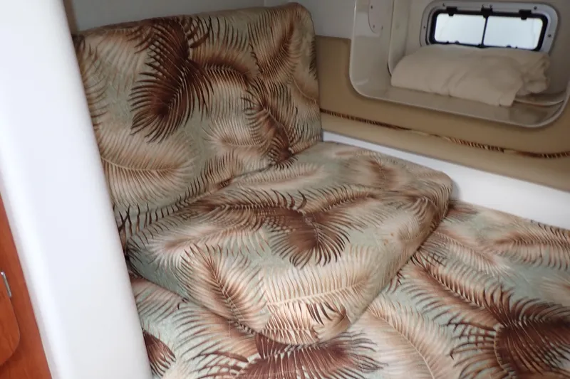 Slide: The Image of Interior cabin of 2014 Pro-Line 32 Express with tropical-patterned upholstery. - 101