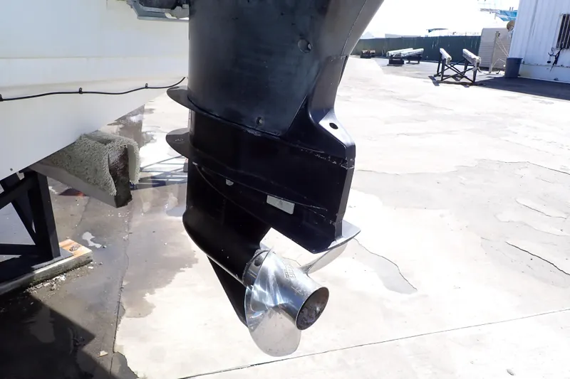 Slide: The Image of Outboard motor of a 2014 Pro-Line 32 Express boat on a dry dock. - 112