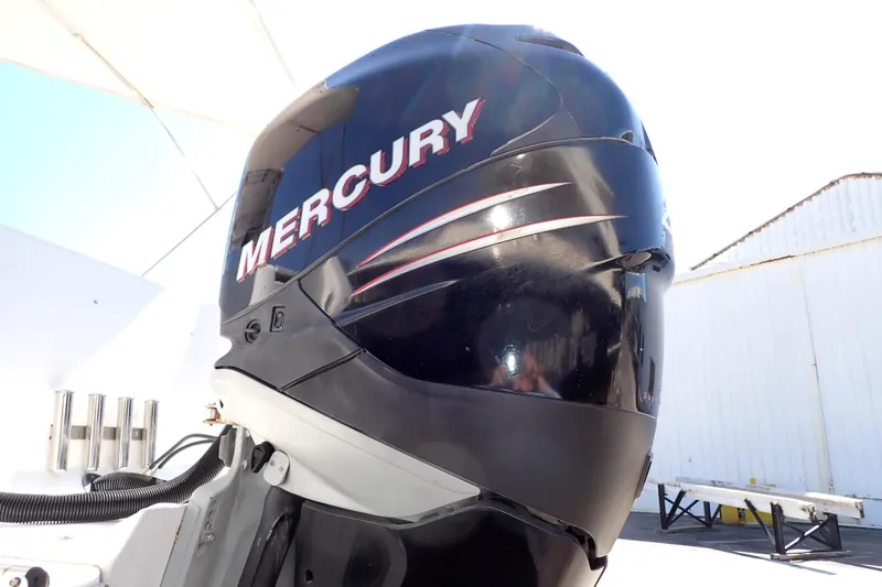 Slide: The Image of Mercury outboard motor on a 2014 Pro-Line 32 Express boat, dockside view. - 116