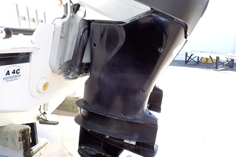 Slide: The Image of Close-up of a 2014 Pro-Line 32 Express boat motor in a marina setting. - 117