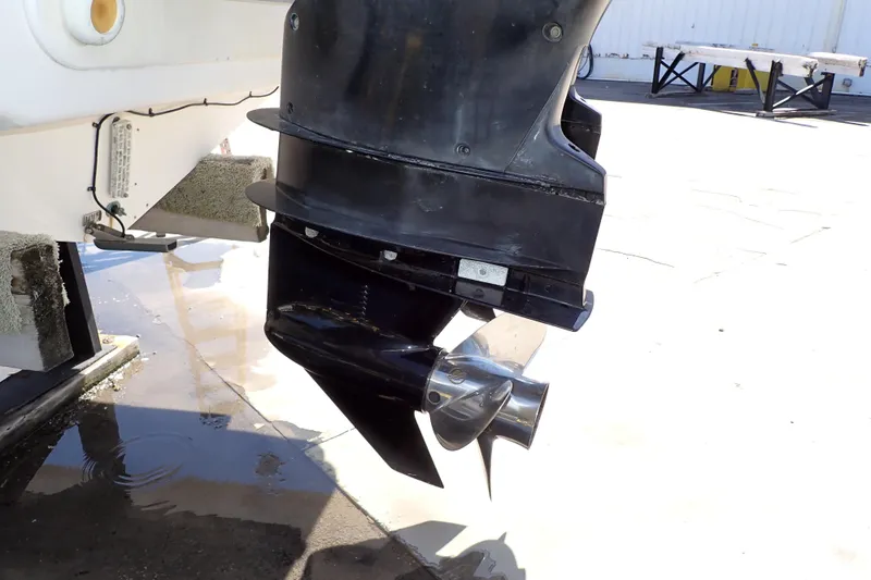 Slide: The Image of 2014 Pro-Line 32 Express boat motor and propeller close-up. - 118