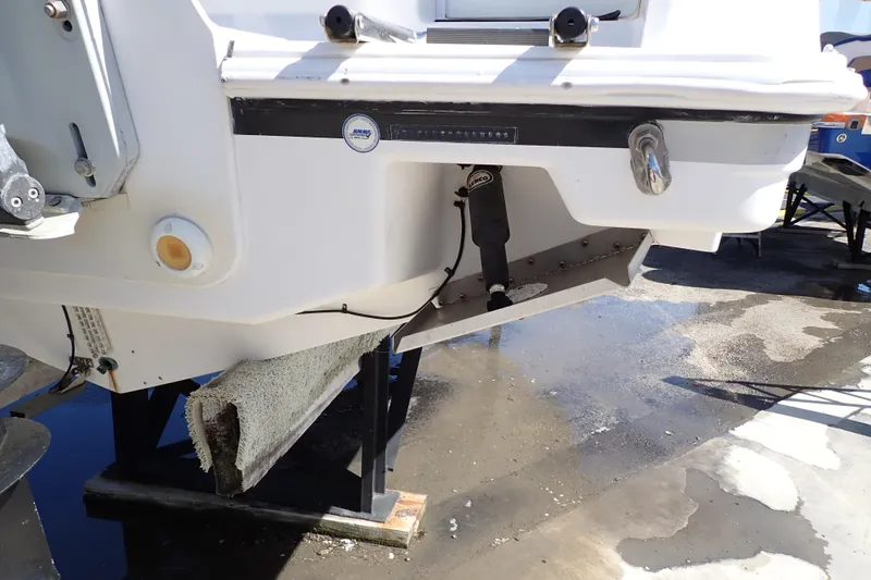 Slide: The Image of 2014 Pro-Line 32 Express boat hull on a stand, showing underside details. - 120