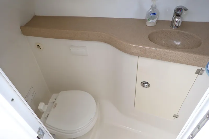 Slide: The Image of Bathroom interior of 2014 Pro-Line 32 Express boat with sink and toilet. - 13