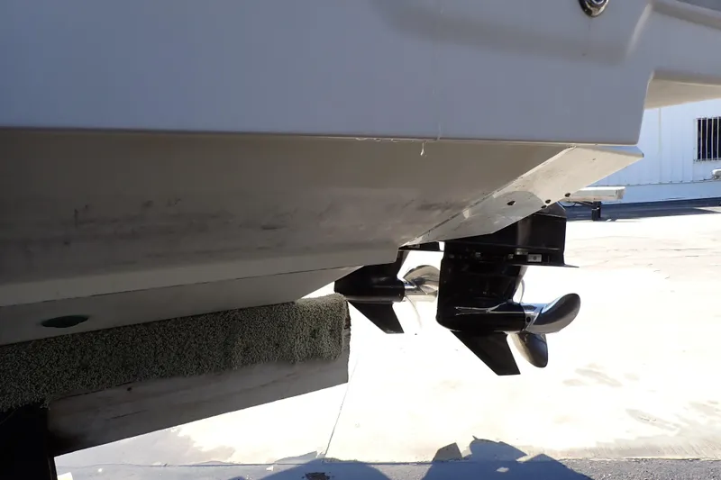 Slide: The Image of 2014 Pro-Line 32 Express boat hull and propellers in dry dock. - 130