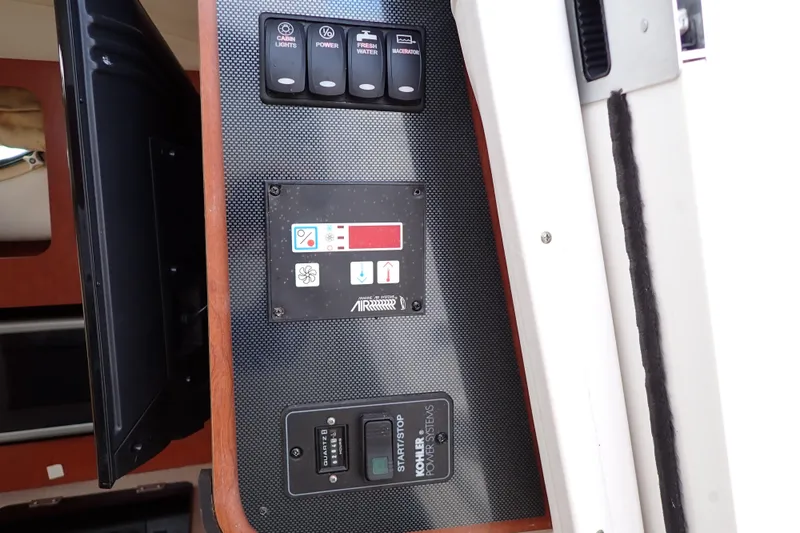 Slide: The Image of Control panel of 2014 Pro-Line 32 Express boat with switches and indicators. - 15