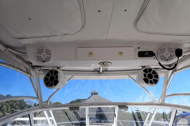 Slide: The Image of Interior view of a 2014 Pro-Line 32 Express boat with speakers and radio system. - 21
