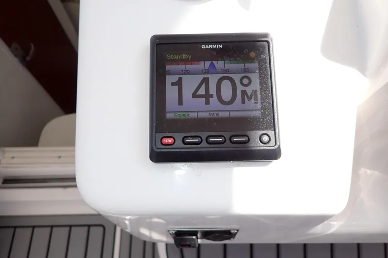 Slide: The Image of Garmin display on 2014 Pro-Line 32 Express boat showing heading of 140 degrees. - 27