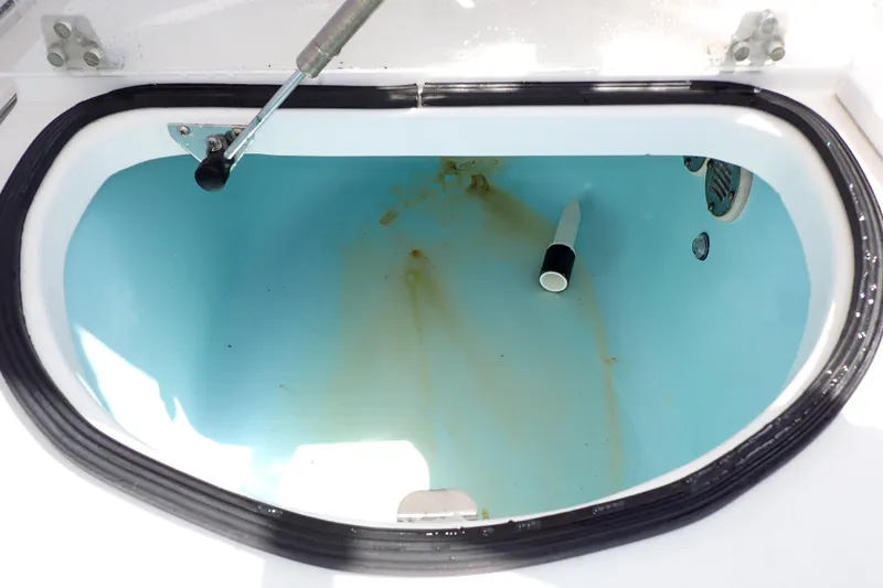 Slide: The Image of Open hatch of 2014 Pro-Line 32 Express boat, showing interior compartment. - 30