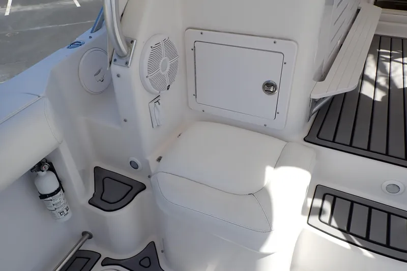 Slide: The Image of 2014 Pro-Line 32 Express boat interior with seating, storage, and safety equipment. - 33