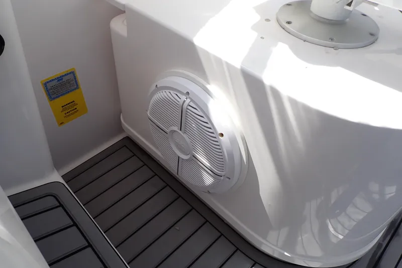 Slide: The Image of 2014 Pro-Line 32 Express boat interior with speaker and non-slip flooring. - 37
