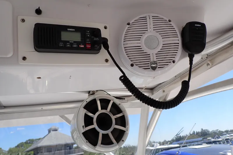 Slide: The Image of 2014 Pro-Line 32 Express boat interior with Uniden radio and speakers. - 38