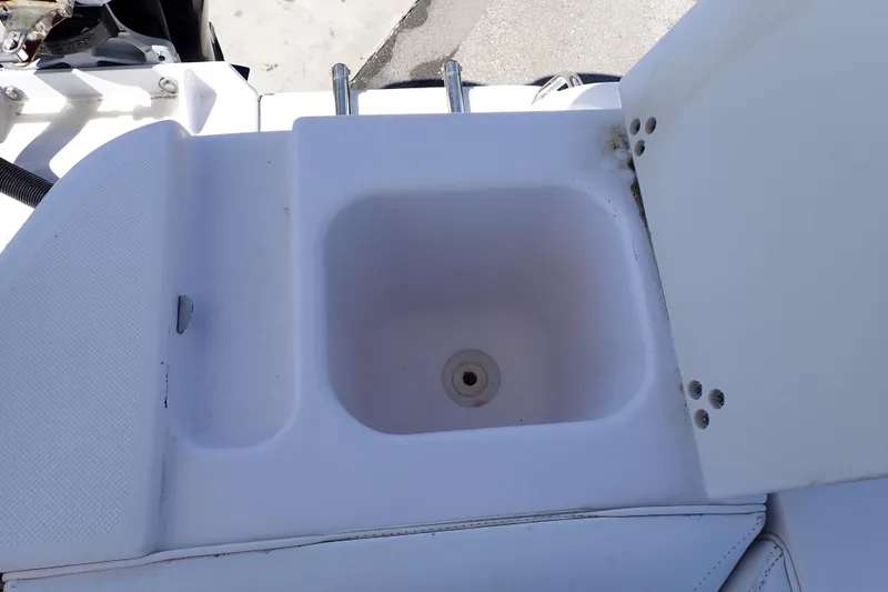 Slide: The Image of 2014 Pro-Line 32 Express boat sink with open lid, showcasing clean design. - 44