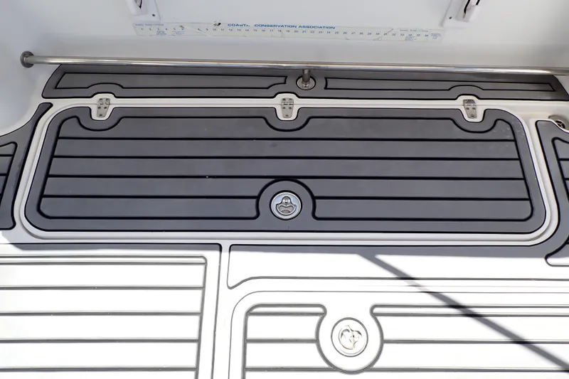 Slide: The Image of 2014 Pro-Line 32 Express boat deck with sleek, modern design and secure fittings. - 49